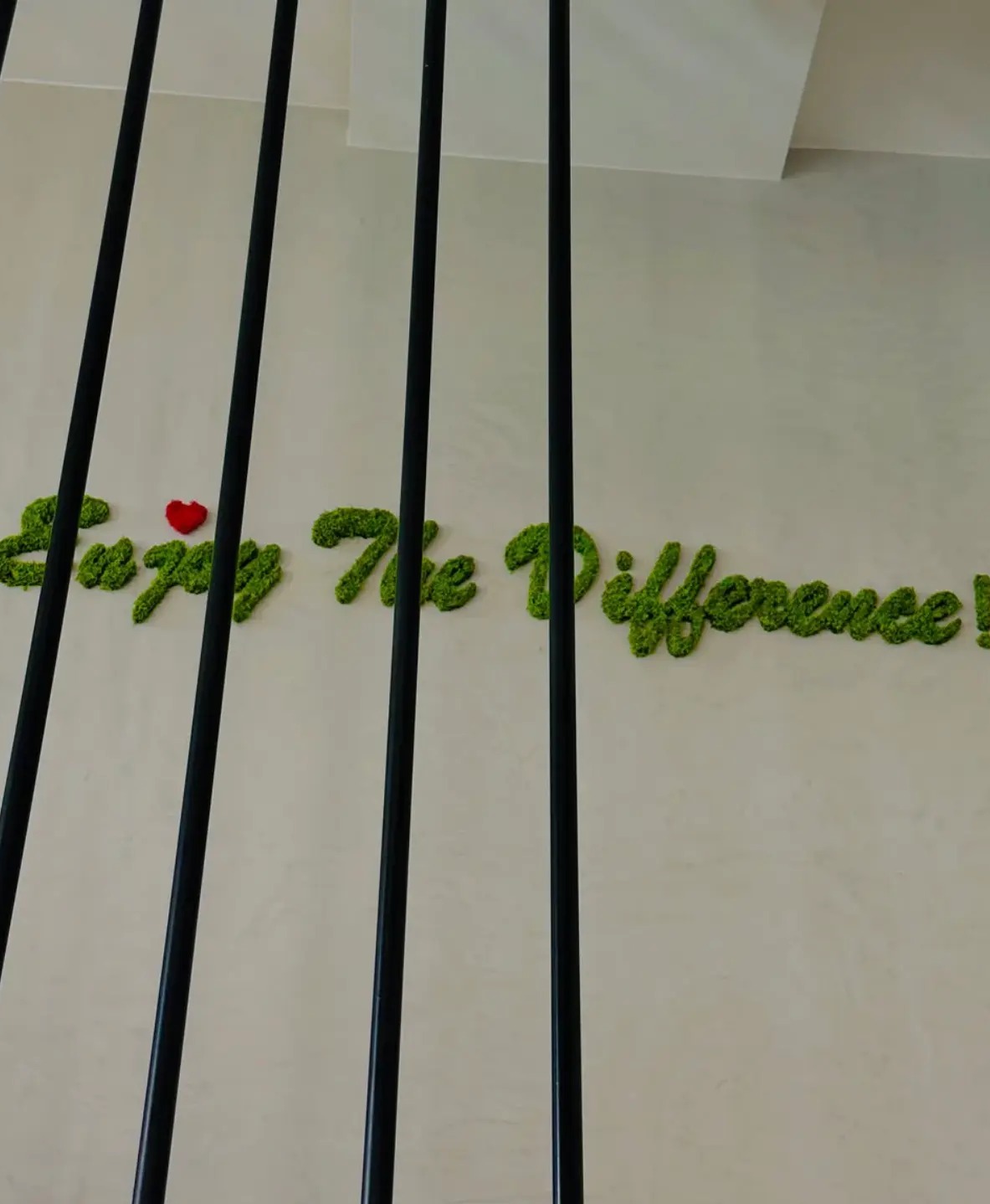 Moss wall art reading Enjoy The Difference